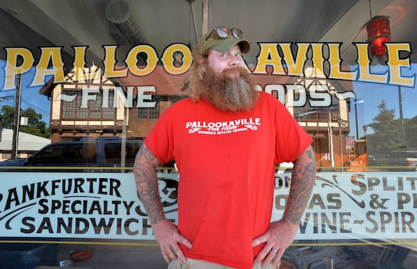 October 11, 2013 Avondale Estates - Portrait of chef-owner Jim Stacy at his new restaurant Pallookaville Fine Foods in Avondale Estates on Friday, October 11, 2013. A look at Jim Stacy, the massive, tatted, overall wearing fry cook who is making the talk-show rounds, including Jay Leno, and opening a new restaurant in Avondale, called Pallookaville Fine Foods. HYOSUB SHIN / HSHIN@AJC.COM October 11, 2013 Avondale Estates - Portrait of chef-owner Jim Stacy at his new restaurant Pallookaville Fine Foods in Avondale Estates on Friday, October 11, 2013. A look at Jim Stacy, the massive, tatted, overall wearing fry cook who is making the talk-show rounds, including Jay Leno, and opening a new restaurant in Avondale, called Pallookaville Fine Foods. HYOSUB SHIN / HSHIN@AJC.COM