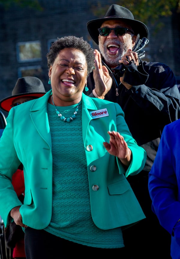 Atlanta mayoral candidate Felicia Moore and State House Representative Dewey McClain listen to the speakers at a get-out-the-vote rally in Atlanta Monday, November 29, 2021.  STEVE SCHAEFER FOR THE ATLANTA JOURNAL-CONSTITUTION