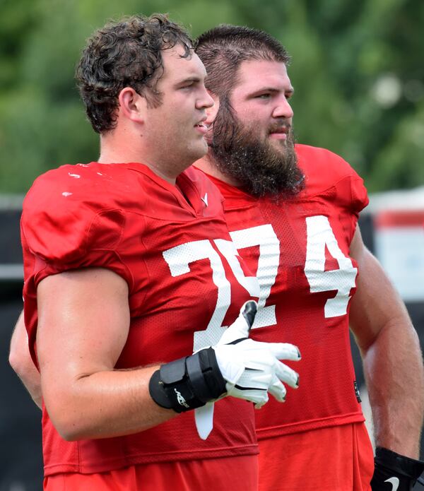 Georgia offensive linemen Owen Condon (75) and Ben Cleveland (74) during the Bulldogs' practice Monday, Aug. 31, 2020, in Athens.