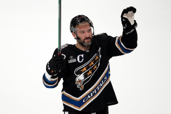 Washington Capitals left wing Alex Ovechkin (8) waves to the crowd after an NHL hockey game against the Nashville Predators, Wednesday, Nov. 6, 2024, in Washington. The Capitals won 3-2. (AP Photo/Nick Wass)