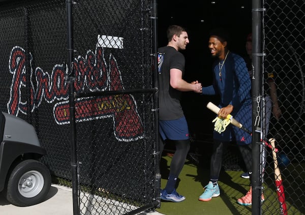 Braves third baseman Austin Riley (left) greets outfielder Ronald Acuña Jr. at CoolToday Park on Wednesday.