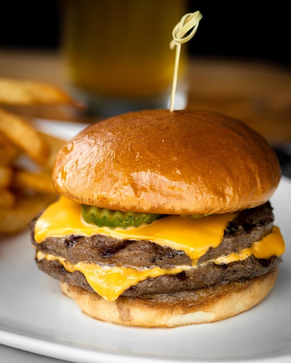 The Royale with Cheese (wagyu beef seared and stacked with American cheese, dill pickle on buttery sesame brioche) is a favorite of Marlow's Tavern patrons. (Courtesy of Marlow's Tavern)