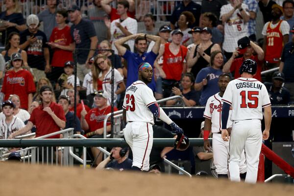 Braves center fielder Michael Harris, center, looks back after he lined into a double play as second baseman Phil Gosselin (15) was out at first base during the ninth inning against the St. Louis Cardinals at Truist Park Thursday, July 7, 2022, in Atlanta. The Cardinals won 3-2. (Jason Getz / Jason.Getz@ajc.com) 