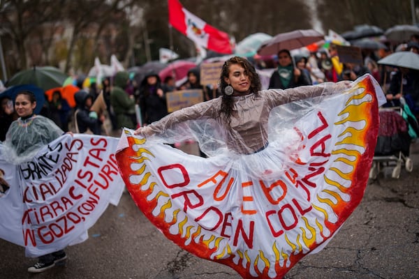 Demonstrators rally during an International Women's Day protest in Madrid, Spain, Saturday, March 8, 2025. (AP Photo/Bernat Armangue)