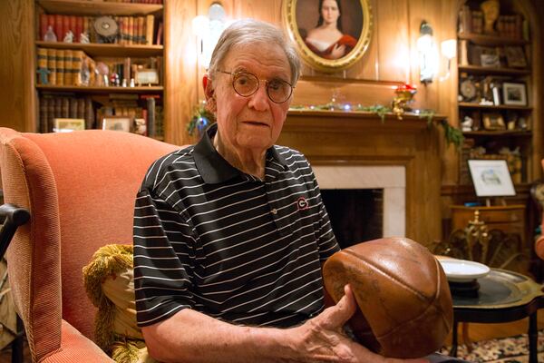 Frank J. Troutman Jr., 83, sits in his home and talks about his experience at the 1943 Rose Bowl when the University of Georgia defeated the University of California, Los Angeles, Tuesday, December 19, 2017.  Frank Jr. was 8 years old when he traveled with his parents by train to see the Bulldogs take on the Bruins in Pasadena, California. ALYSSA POINTER/ALYSSA.POINTER@AJC.COM