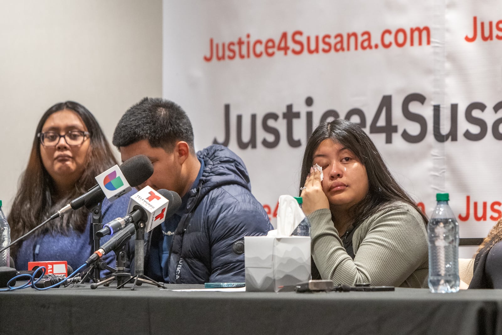 Jasmine Morales, the sister of 16-year-old Susana Morales, wipes away tears during a news conference Thursday morning in Gwinnett County. The body of Susana Morales was discovered in February, more than six months after her family reported her missing. A former Doraville officer has been charged with murder. (Jenni Girtman for The Atlanta Journal-Constitution)