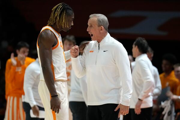 Tennessee head coach Rick Barnes, right, talks with guard Jahmai Mashack, left, in the first half of an NCAA college basketball game against Alabama, Saturday, March 1, 2025, in Knoxville, Tenn. (AP Photo/Mark Humphrey)