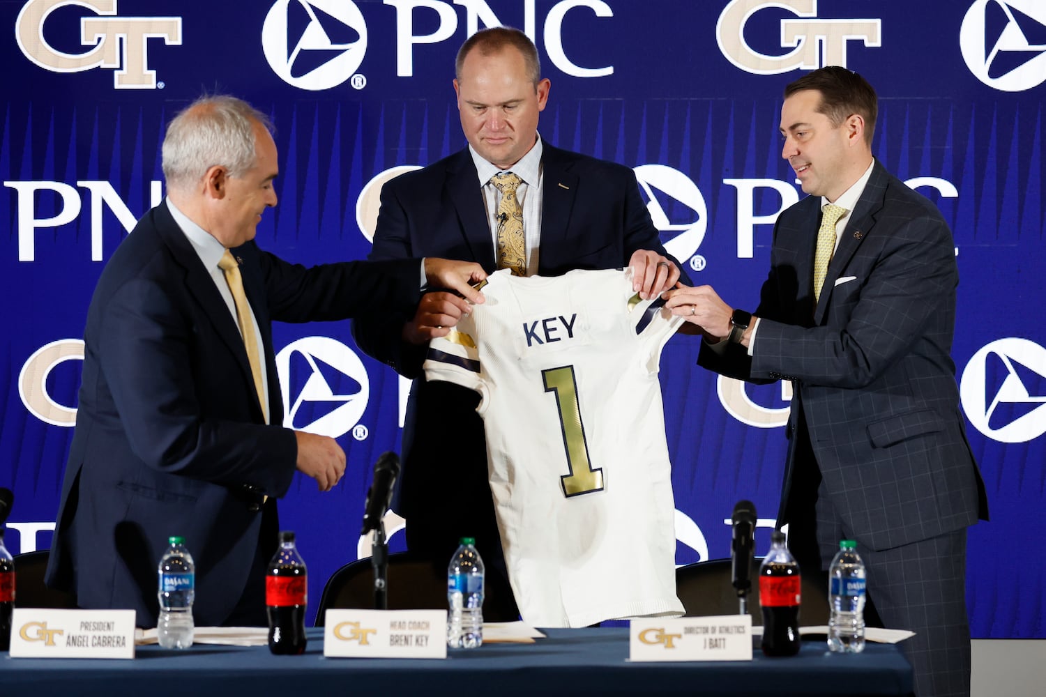 Georgia Tech President Ángel Cabrera and Director of Athletics J. Batt presented the jersey to the new football head coach Brent Key during a news conference on Monday, December 5, 2022.
 Miguel Martinez / miguel.martinezjimenez@ajc.com