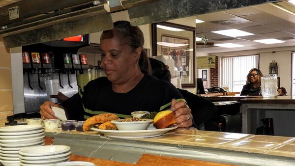 The Four Way owner Patrice Thompson checks on orders during the Sunday lunchtime rush at her restaurant in Memphis. Thompson said King routinely stopped by for soul food when he was in town. (Jay Jones/Chicago Tribune/TNS)