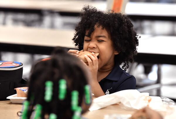 Kindergartner Matthew Blake, 5, eats his lunch at Cliftondale Elementary School in College Park on Wednesday, Oct. 13. Metro Atlanta school districts are having to be creative to revise and rework menus because of national food supply issues. The COVID-19 pandemic has made it difficult for districts to get some of their usual food items. (Hyosub Shin / Hyosub.Shin@ajc.com)