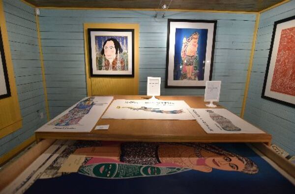 Framed and loose prints are among items stocked in the shop in the new Visitors Center at folk artist Howard Finster's Paradise Garden. HYOSUB SHIN / HSHIN@AJC.COM