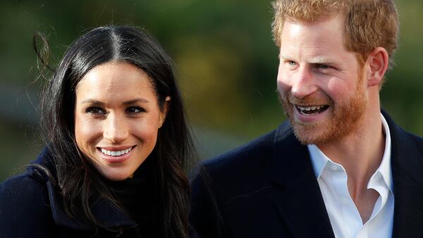 FILE - In this Dec. 1, 2017 file photo, Britain's Prince Harry and his fiancee Meghan Markle arrive at Nottingham Academy in Nottingham, England. Prince Harry's fiancee is set to join Britain's royal family for Christmas. Kensington Palace says Meghan Markle will join Queen Elizabeth II and other senior royals at Sandringham, a sprawling estate in Norfolk, 110 miles (175 kilometers) north of London, it was announced on Wednesday, Dec. 13, 2017.  (AP Photo/Frank Augstein, File)