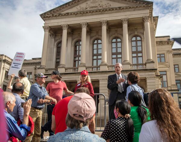 Garland Favorito (right), co-founder of Voter GA, speaks outside the Georgia Capitol in November. Favorito is the lead plaintiff in a lawsuit that spurred a judge's ruling allowing the review of 147,000 Fulton County absentee ballots. (Alyssa Pointer / Alyssa.Pointer@ajc.com)