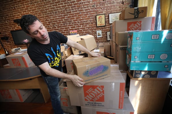 Alex Khodorkovsky arranges boxes with donated goods for Ukraine out of the offices of the GotoRussia travel agency.
Miguel Martinez for The Atlanta Journal-Constitution 