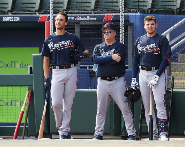 031622 North Port: Atlanta Braves first baseman Matt Olson (from left), hitting coach Kevin Seitzer, and third baseman Austin Riley watch pitcher Dylan Lee throw live batting practice during Spring Training at CoolToday Park on Wednesday, March 16, 2022, in North Port.    “Curtis Compton / Curtis.Compton@ajc.com”