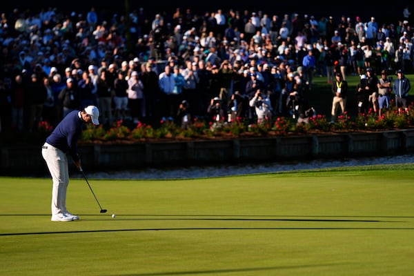 Rory McIlroy, of Northern Ireland, putts on the 16th green during a playoff round of The Players Championship golf tournament Monday, March 17, 2025, in Ponte Vedra Beach, Fla. (AP Photo/Julia Demaree Nikhinson)