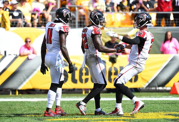 Mohamed Sanu celebrates with Matt Ryan and Julio Jones after his touchdown catch. (Photo by Joe Sargent/Getty Images)