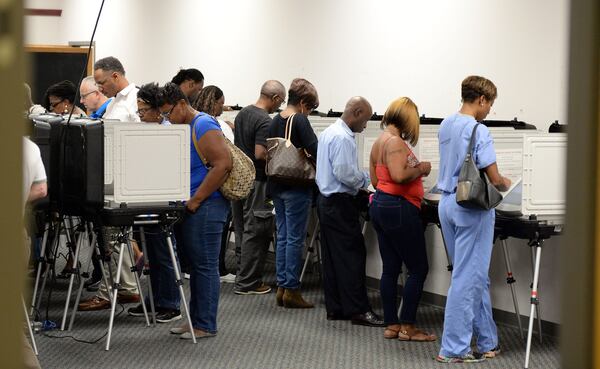 DeKalb County voters line up for early voting at the Voter Registration & Elections office on Oct. 17. KENT D. JOHNSON / AJC