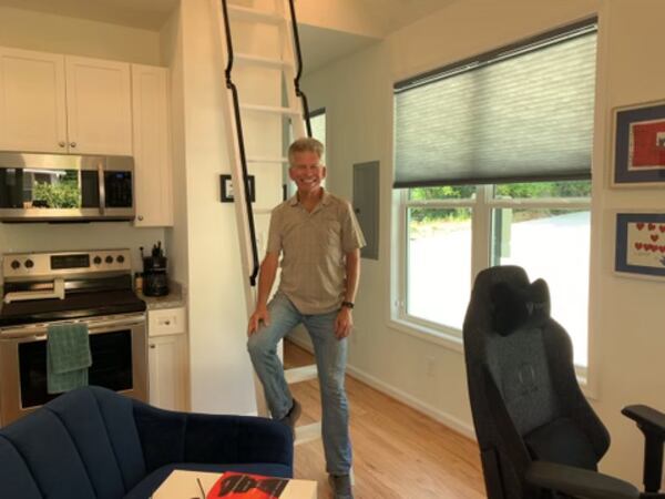 Rich Pasenow standing in his 250-square-foot home on July 22.