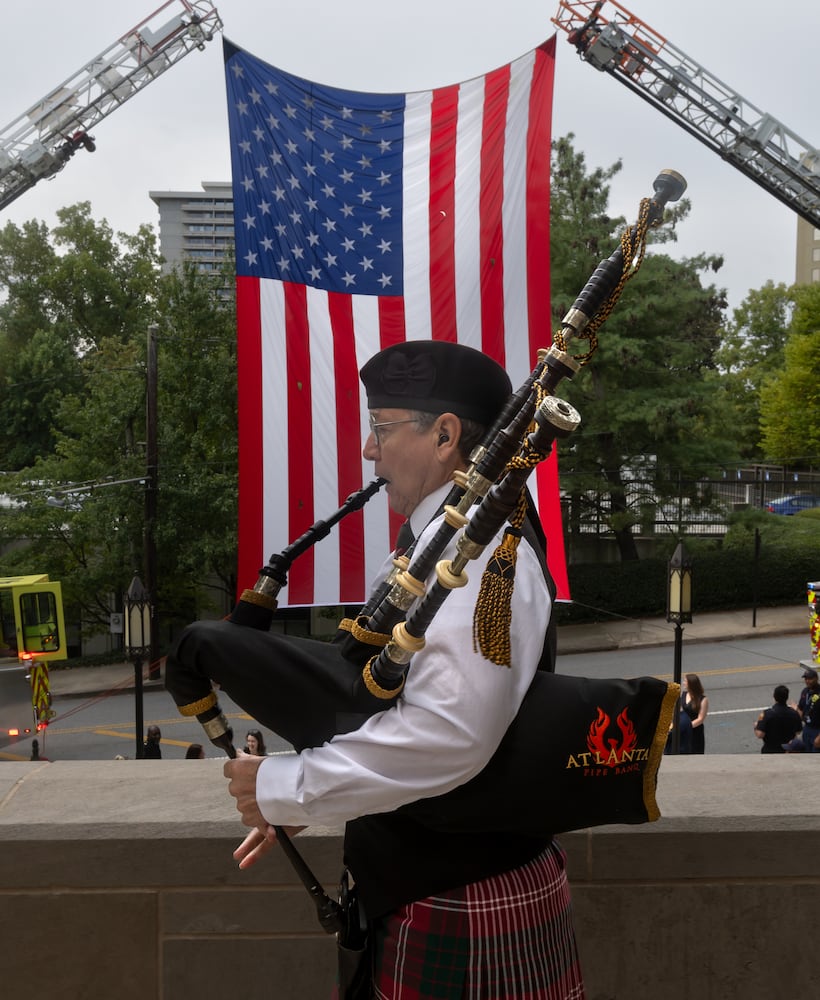 Tom Crawford of the Atlanta Pipe Band plays the bagpipe at the Cathedral of Christ the King located at 2699 Peachtree Road NE in Buckhead for the Annual Blue Mass honoring safety officials and first responders. Atlanta Mayor Andre Dickens along with Atlanta Rescue Fire and Atlanta Police were in attendance to join parishioners and members of the public to pray and show appreciation for those who serve and protect the public in observance of 9-11.