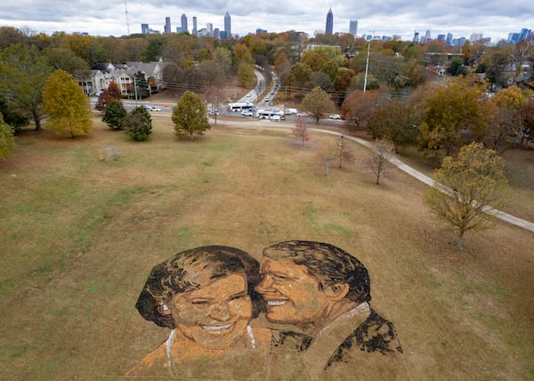 A portrait of Rosalynn and Jimmy Carter made from mulch, peat moss and stones sits on a hill in Freedom Park in Atlanta on Wednesday, Nov. 22, 2023.   (Ben Gray / Ben@BenGray.com)