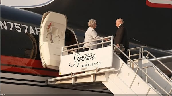 Trump advisor Susie Wiles greets former president Donald Trump's Atlanta-based attorney, Steve Sadow, after Trump landed at Harfsfield-Jackson International Airport Aug. 24, 2023.