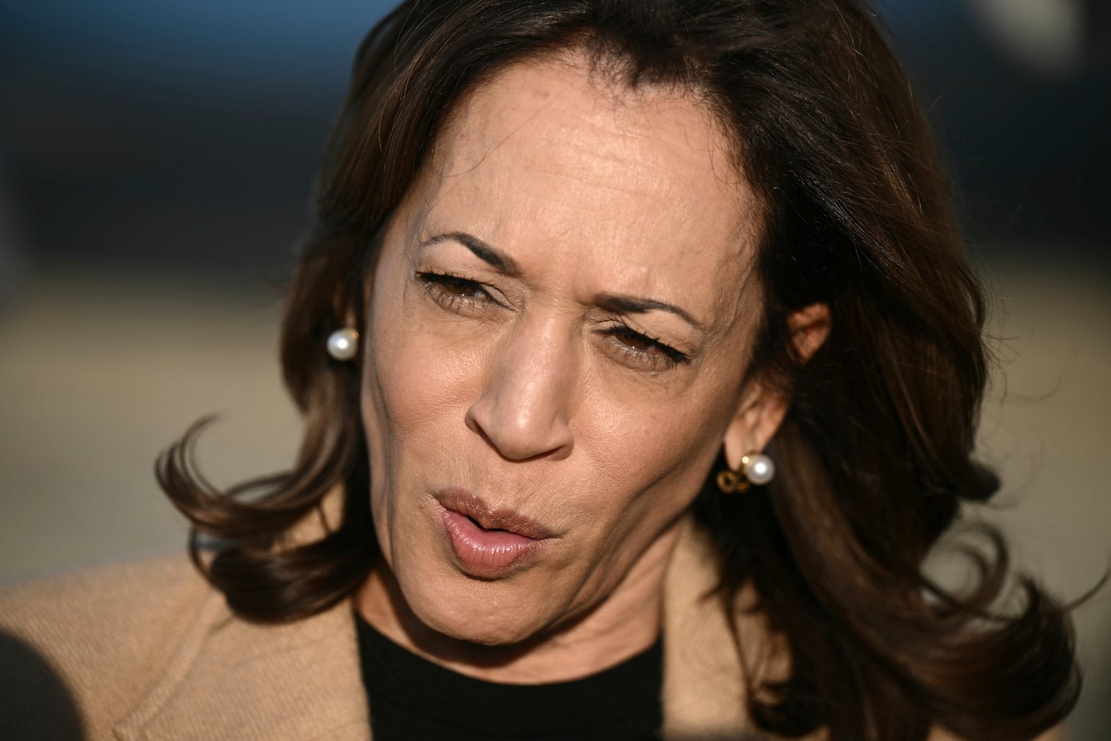 Democratic presidential nominee Vice President Kamala Harris speaks to the press before boarding Air Force Two at Joint Base Andrews, Md., Saturday, Oct. 12, 2024, en route to North Carolina for a campaign event. (Brendan Smialowski/Pool via AP)