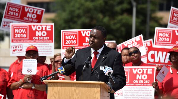 Georgia PTA President Tyler Barr speaks during a rally outside the state Capitol in August. He believes schools should have classes for students to teach them about the proper uses of social media that would discourage them from posting videos of school fights. 