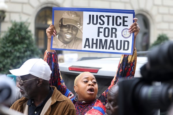 A protester supports the family of Ahmaud Arbery after oral arguments outside of the 11th U.S. Circuit Court of Appeals, Wednesday, March 27, 2024, in Atlanta. (Jason Getz / jason.getz@ajc.com)