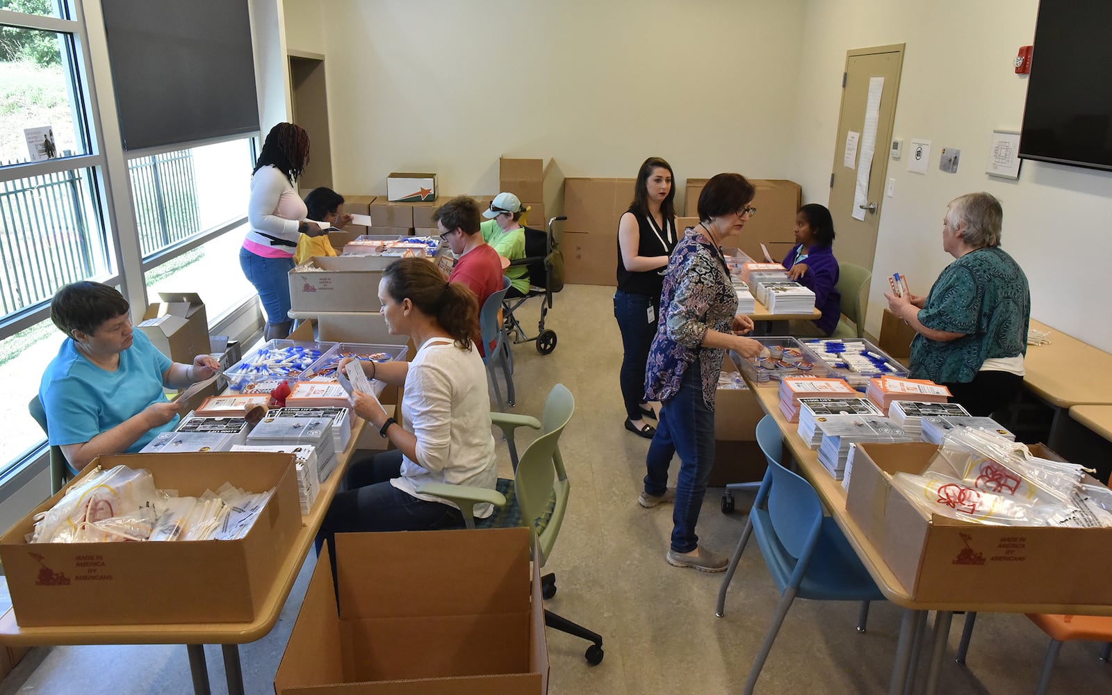 Volunteers prepare for the AJC Peachtree Road Race