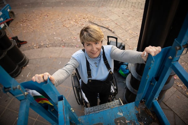 Though she uses a wheelchair, artist Megan Mosholder is developing enough strength in her legs to stand up for short periods. PHOTO BY ELISSA BENZIE