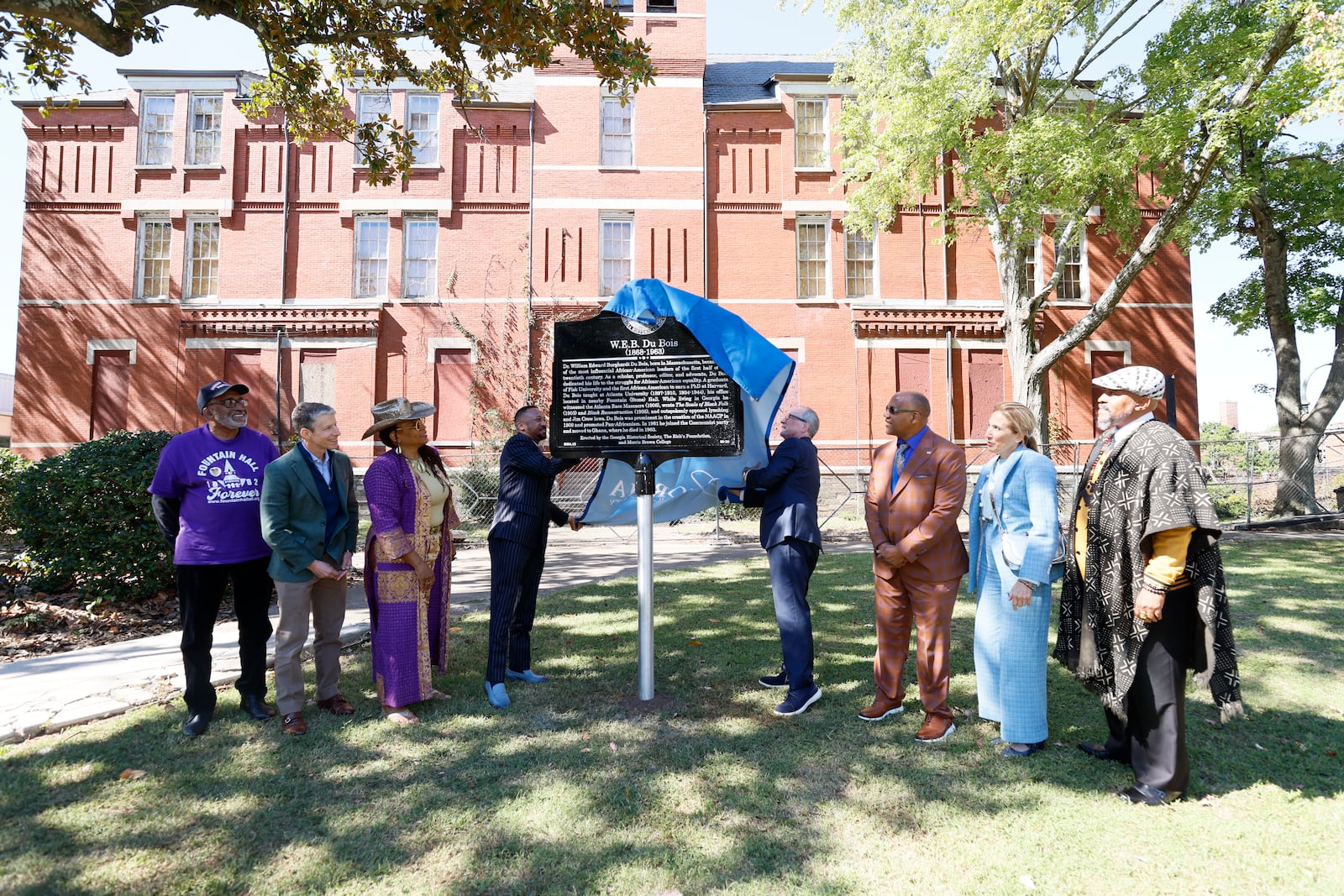 Morris Brown College President Kevin James, and W. Todd Groce, CEO of the Georgia Historical Society unveil the marker honoring the life and work of W.E.B. Du Bois at Morris Brown College on Wednesday, October 16, 2024. The great-grandson of W.E.B. Du Bois, Jeffrey Du Bois Peck Sr. (brown suit) witnessed the unveiling.
(Miguel Martinez / AJC)