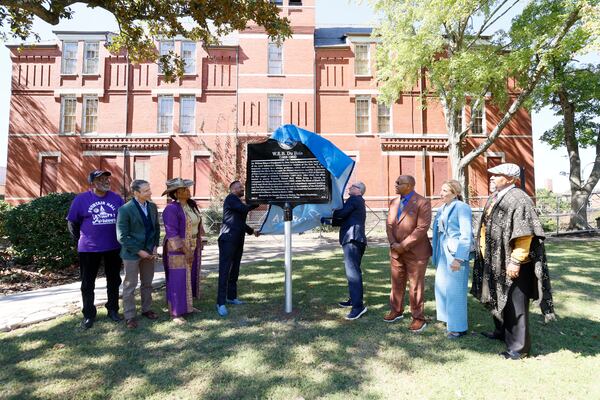 Morris Brown College President Kevin James, and W. Todd Groce, CEO of the Georgia Historical Society unveil the marker honoring the life and work of W.E.B. Du Bois at Morris Brown College on Wednesday, October 16, 2024. The great-grandson of W.E.B. Du Bois, Jeffrey Du Bois Peck Sr. (brown suit) witnessed the unveiling.
(Miguel Martinez / AJC)