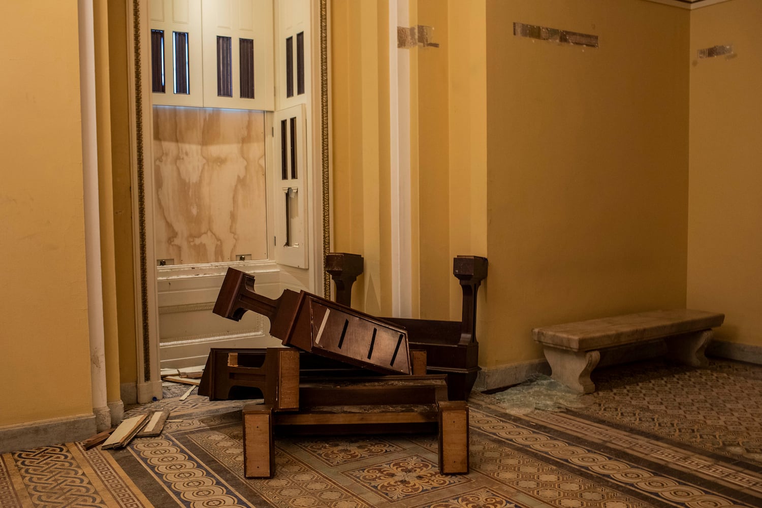 Destroyed cabinets that displayed books about women in politics at the Capitol in Washington on Thursday, Jan. 7, 2021, were destroyed during the riot on Wednesday. (Jason Andrew/The New York Times)