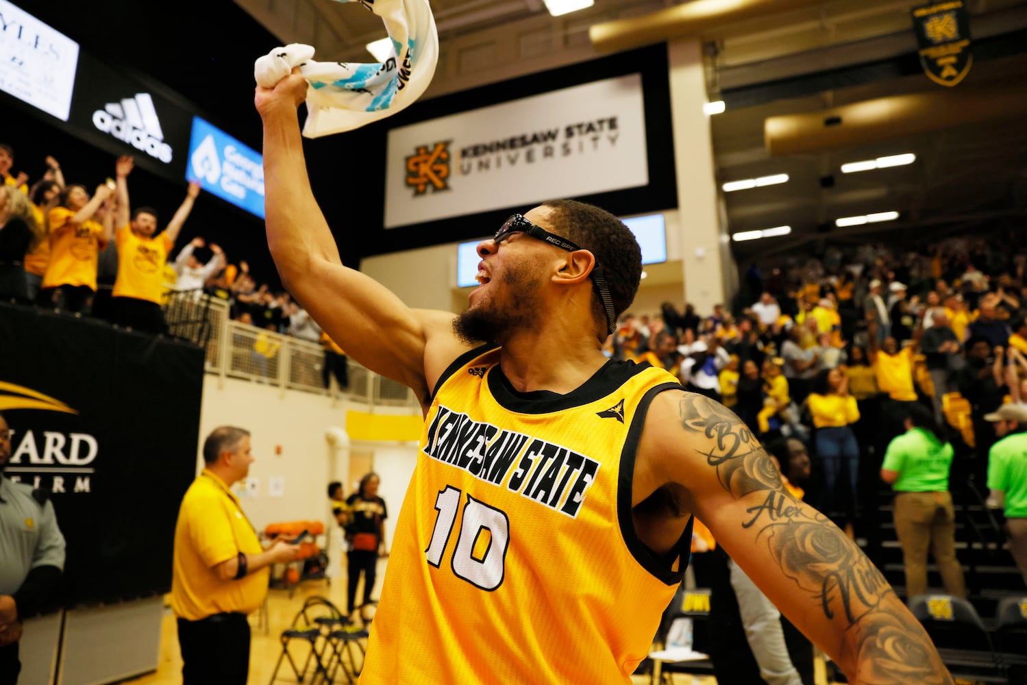 Kennesaw State forward Alex Peterson celebrates with fans.
 Miguel Martinez / miguel.martinezjimenez@ajc.com
 