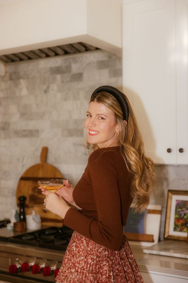 Blogger Cynthia Ruff stands in the kitchen of her home in Buckhead.