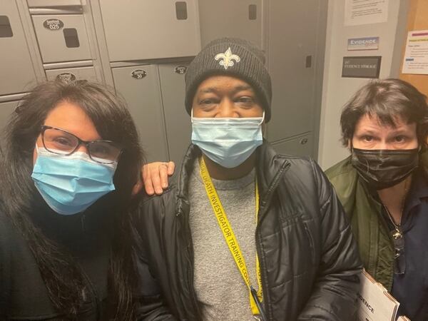 Eric Bailey and co-workers Shannon Volkodav (left) and Tina Miller (right) at the Gwinnett County Police Department in February 2021. Nearly two-and-a-half years after his diagnosis, his colleagues are aiding in his search for a new kidney. (Courtesy of Shannon Volkodav)