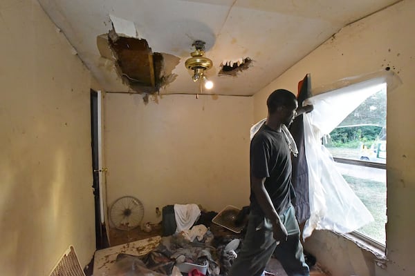 Ulysse Preston shows damage from Hurricane Michael at his trailer home in Randolph County, one of the Georgia counties most vulnerable to natural disasters. Long after the storm Preston and his family were living in the home but still struggling to save enough money to get it fixed. (Hyosub Shin / Hyosub.Shin@ajc.com)