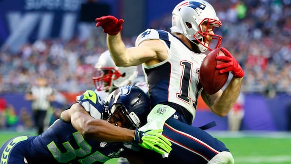 Patriots wide receiver Julian Edelman runs with the ball after a catch against the Seattle Seahawks during Super Bowl XLIX.