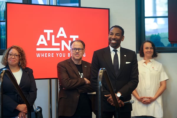 Atlanta Mayor Andre Dickens, second from right, is introduced to speak during the Metro Atlanta Chamber event that announced the new marketing campaign, “Where You Belong,” at the St. Regis Hotel, Monday, April 22, 2024, in Atlanta. (Jason Getz / AJC)
