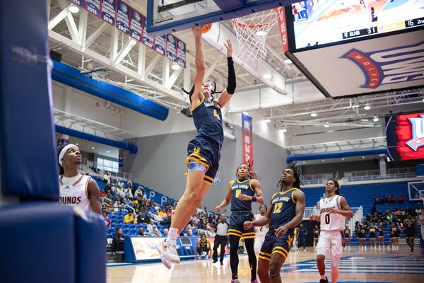 Kenny Brayboy goes up for a shot during the GHSA AAAAA boys Jones County vs Eagles Landing basketball playoff game at the University of West Gerogia in Carrolton, March 3, 2023. Jamie Spaar for the Atlanta Journal-Constitution