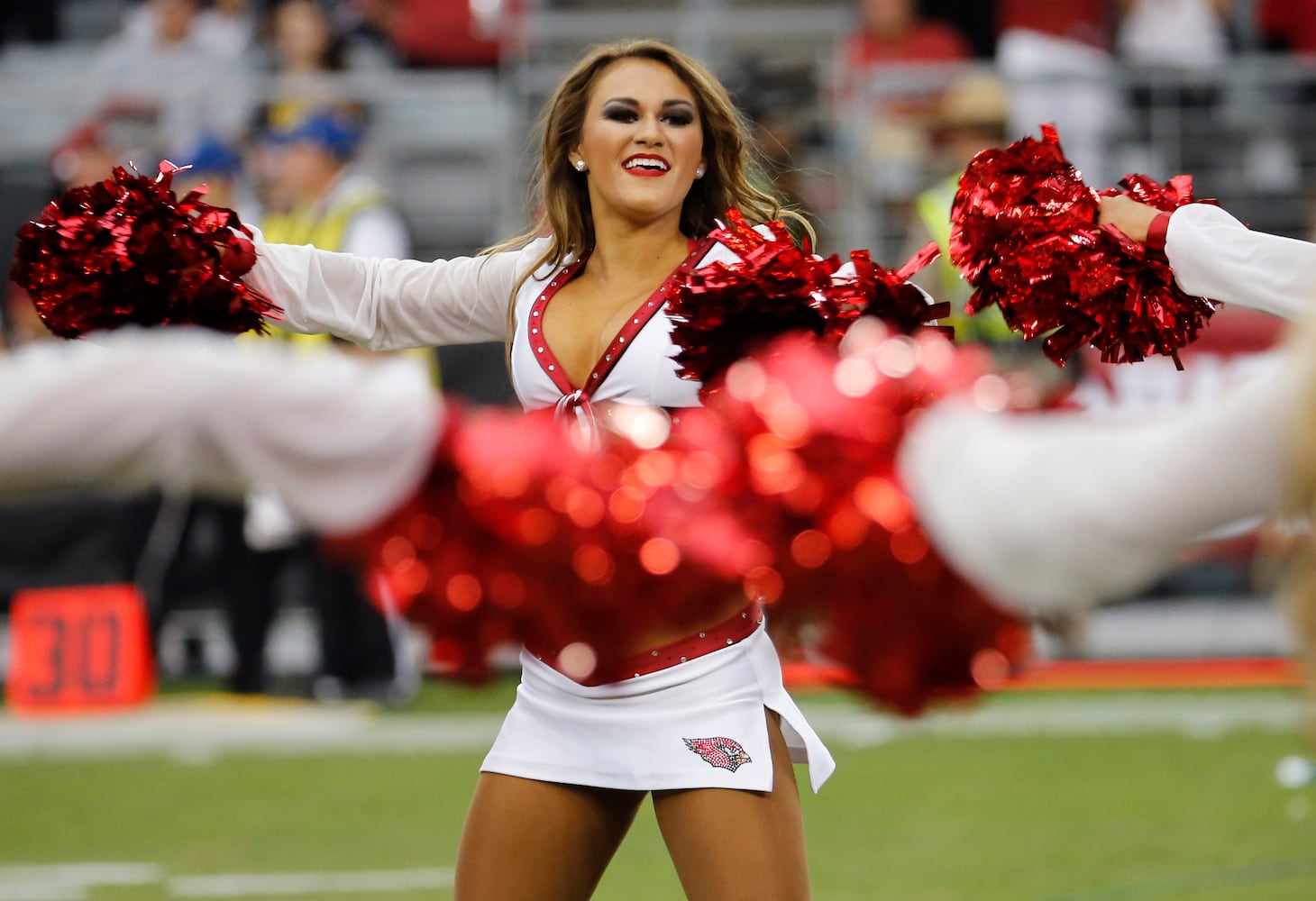 NFL cheerleaders perform at preseason games