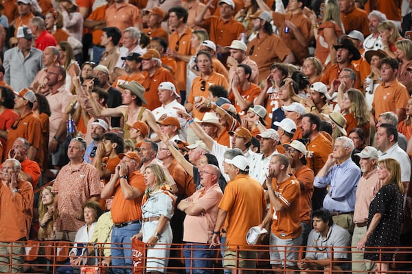 Texas fans react to a call by officials that negated a Texas interception during their game against Georgia at Darrel K Royal Texas Memorial Stadium, Saturday, October 19, 2024, in Austin, Tx. The call was reversed and the interception stood. (Jason Getz / AJC)

