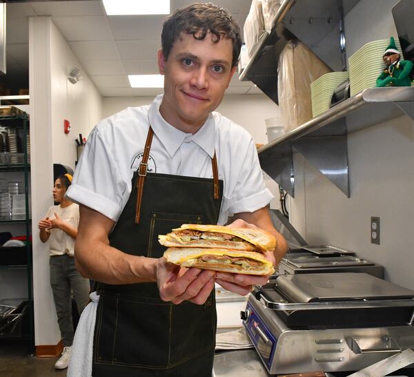 Reid Trapani makes his own seitan ham and jackfruit pork for La Semilla's vegan Cuban sandwich. AAJC122422ATLCULINARYJOURNEYS (CHRIS HUNT FOR THE ATLANTA JOURNAL-CONSTITUTION)