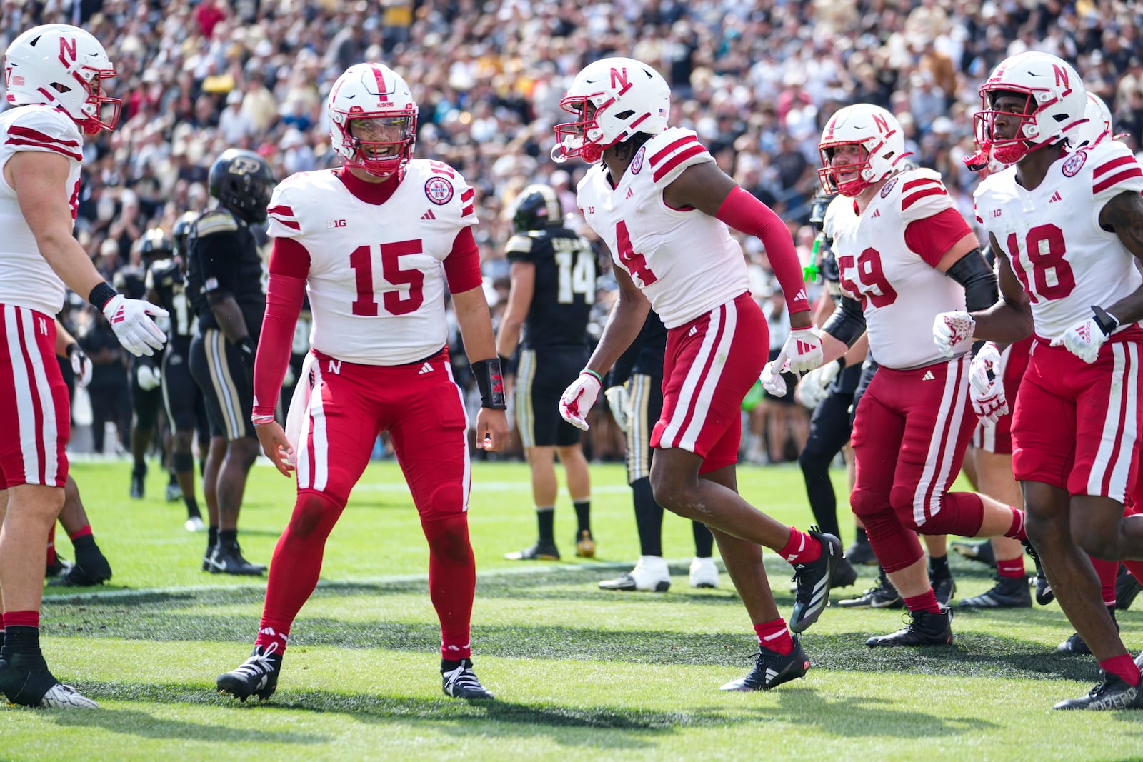 Nebraska wide receiver Jahmal Banks (4) celebrates touchdown catch with quarterback Dylan Raiola (15) during the second half of an NCAA college football game in West Lafayette, Ind., Saturday, Sept. 28, 2024. (AP Photo/Michael Conroy)