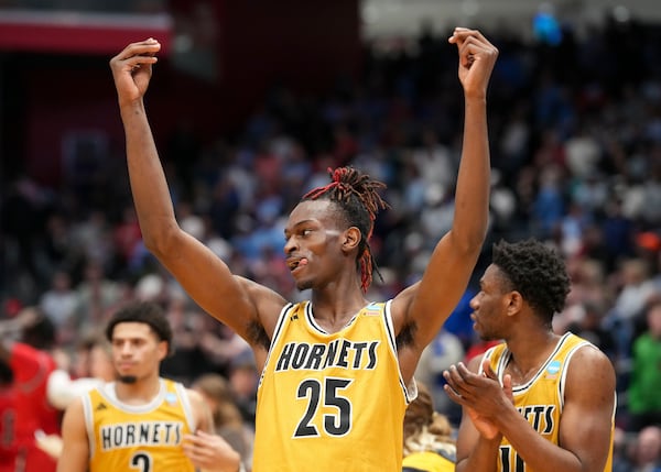 Alabama State's Jasteven Walker (25) celebrates with teammates following the team's 70-68 win over Saint Francis during a First Four college basketball game in the NCAA Tournament, Tuesday, March 18, 2025, in Dayton, Ohio. (AP Photo/Jeff Dean)