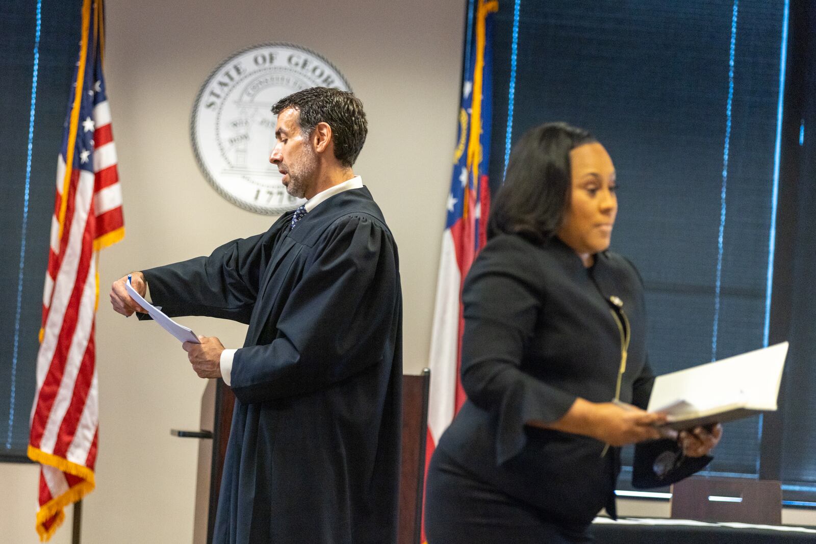 (L-R) Judge Robert McBurney and Fulton County District Attorney Fani Willis are seen in the Jury Assembly Room at Fulton County Courthouse in Atlanta on Tuesday, July 11, 2023. Two Fulton County grand juries are being selected, one of which will be expected to decide whether to hand up an indictment in the long-running investigation into alleged meddling with the 2020 presidential election. (Arvin Temkar/The Atlanta Journal-Constitution)