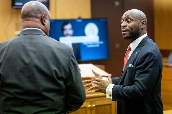 Rudy Giuliani's lawyer Bill Thomas (left) and prosecutor Nathan Wade talk after a hearing in Fulton County Superior Court on Thursday, Aug. 9, 2022. (Steve Schaefer/Atlanta Journal-Constitution/TNS)