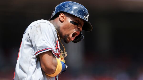 Braves outfielder Ronald Acuna celebrates while running the bases after hitting a solo home run during the fifth inning Sunday June 27, 2021, against the Reds in Cincinnati. (Aaron Doster/AP)