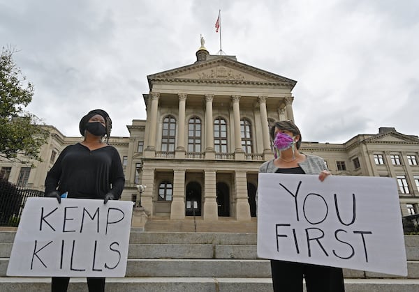 Activists demonstrate outside the Capitol in April 2020 to illustrate what they believed would be the deadly consequences of Kemp's decision to lift some pandemic restrictions after just 22 days. 
 (Hyosub Shin / Hyosub.Shin@ajc.com)